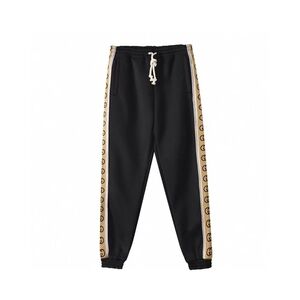 Gucci Black Trousers with Gold Detailing